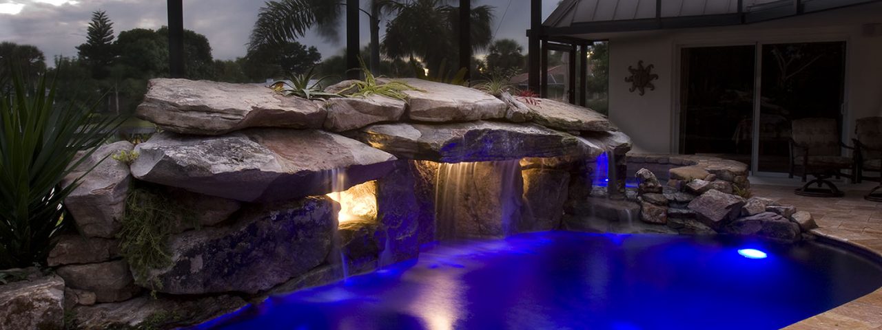 Pool Remodel with Stone Grotto Waterfall and Stone Spa