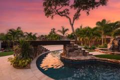 Signature Series Insane Pool with Ipe wood bridge at night