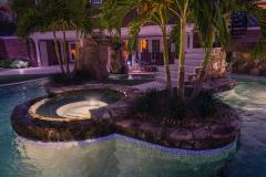 Signature Series Insane Pool with spa at night